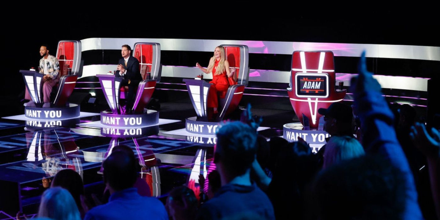 The coaches with their chairs illuminating "I Want You" on 'The Voice' Season 27.