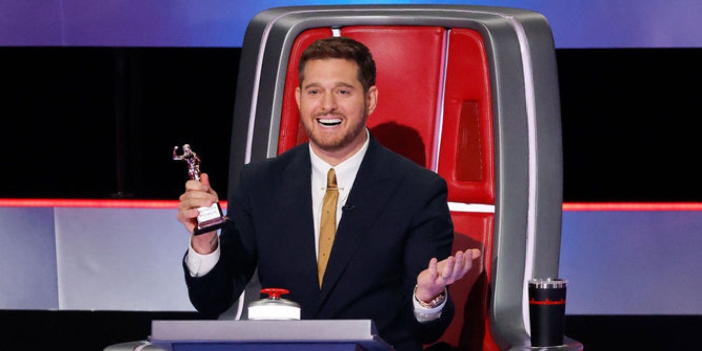 Michael Bublé holds a trophy on 'The Voice' Season 27.