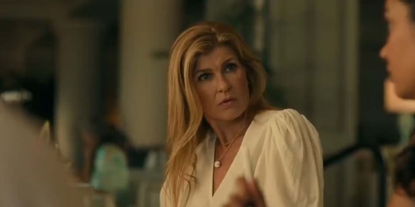 Connie Britton as Nicole Mossbacher looking anxious and talking to someone beside her in The White Lotus.