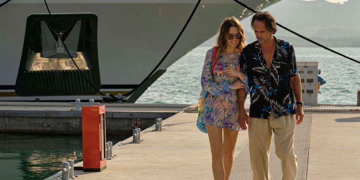 Aimee Lou Wood as Chelsea walking on pier with Walton Goggins as Rick in The White Lotus Season 3, Episode 4.