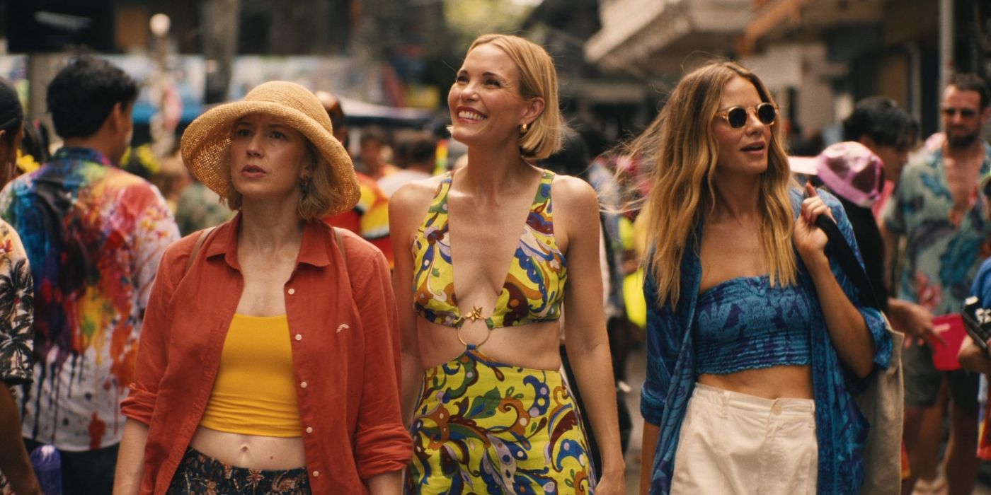 Carrie Coon, Leslie Bibb and Michelle Monaghan walking in market street in The White Lotus Season 3, Episode 4.