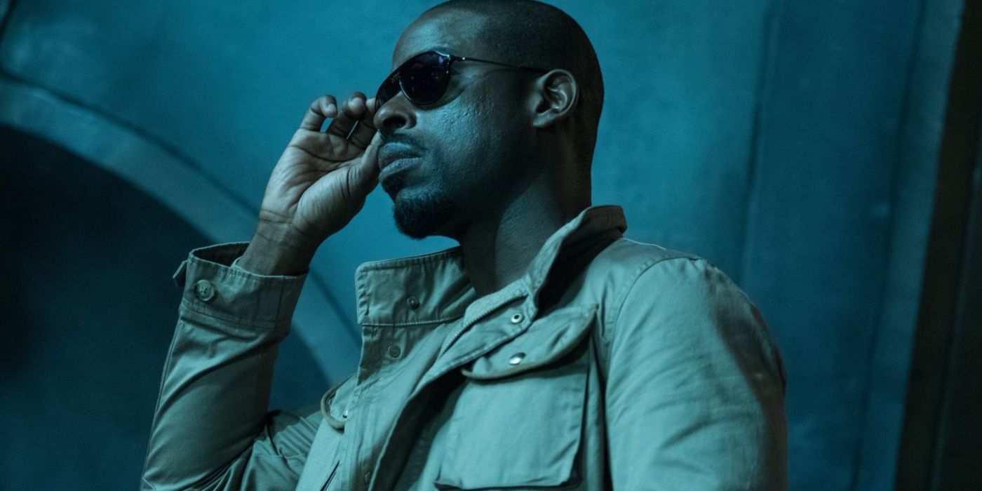 Sterling K. Brown wears sunglasses and looks into the distance in The Predator.