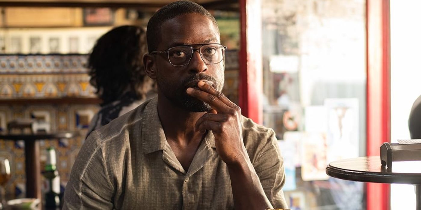 Sterling K. Brown sits in a café and looks pensive in The Rhythm Section.