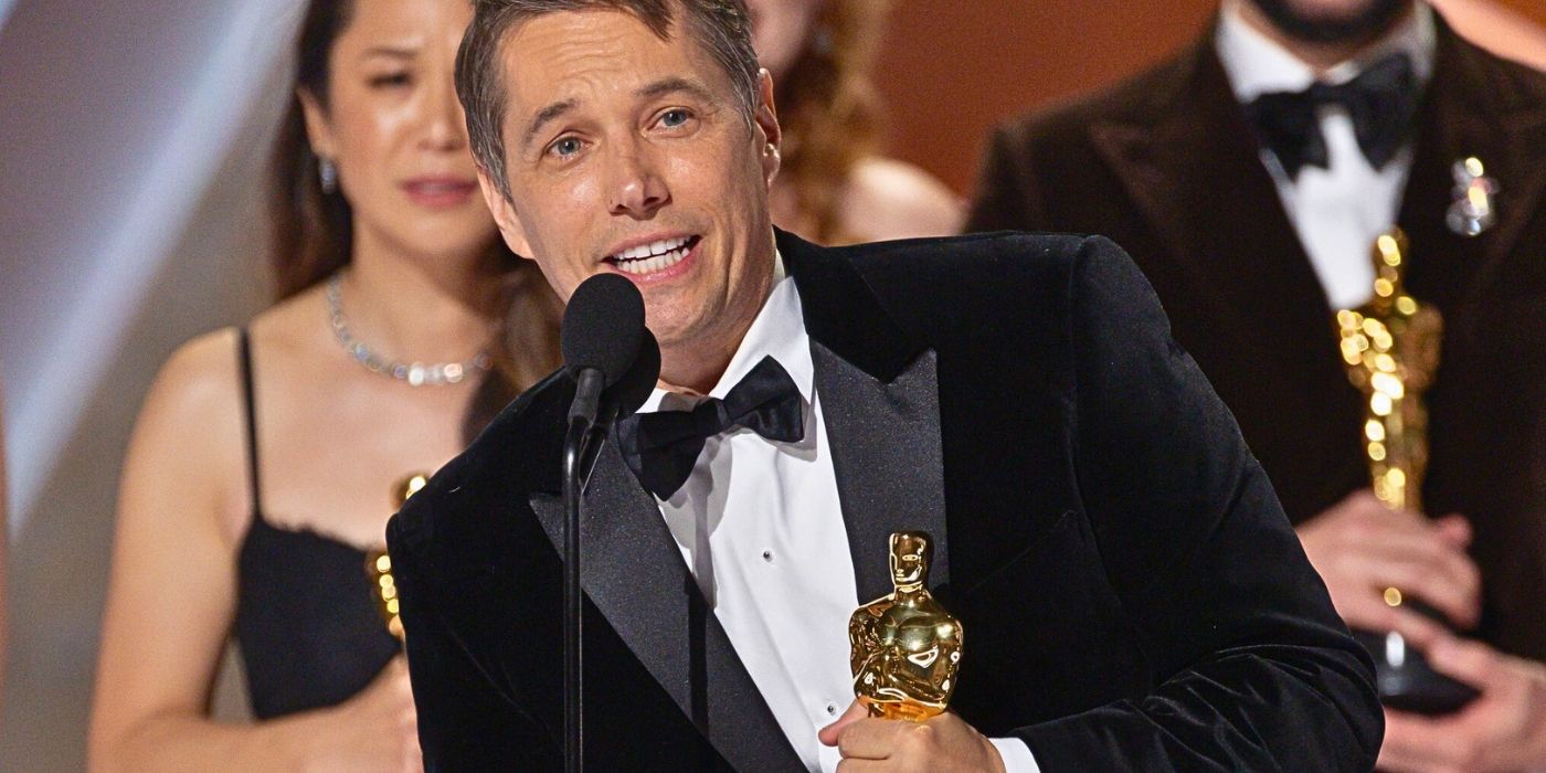 Anora director Sean Baker holding an Oscar 