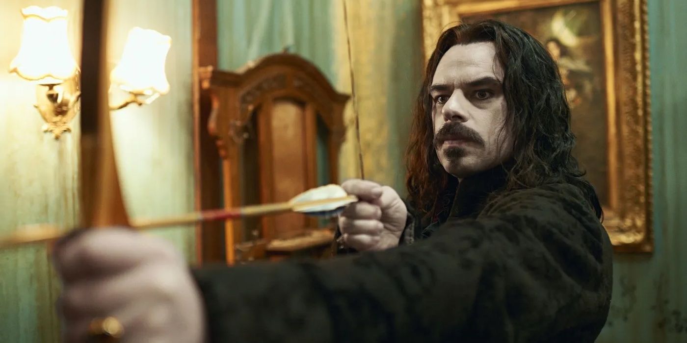 Vladislav (Jemaine Clement) takes aim with an arrow in What We Do in the Shadows.