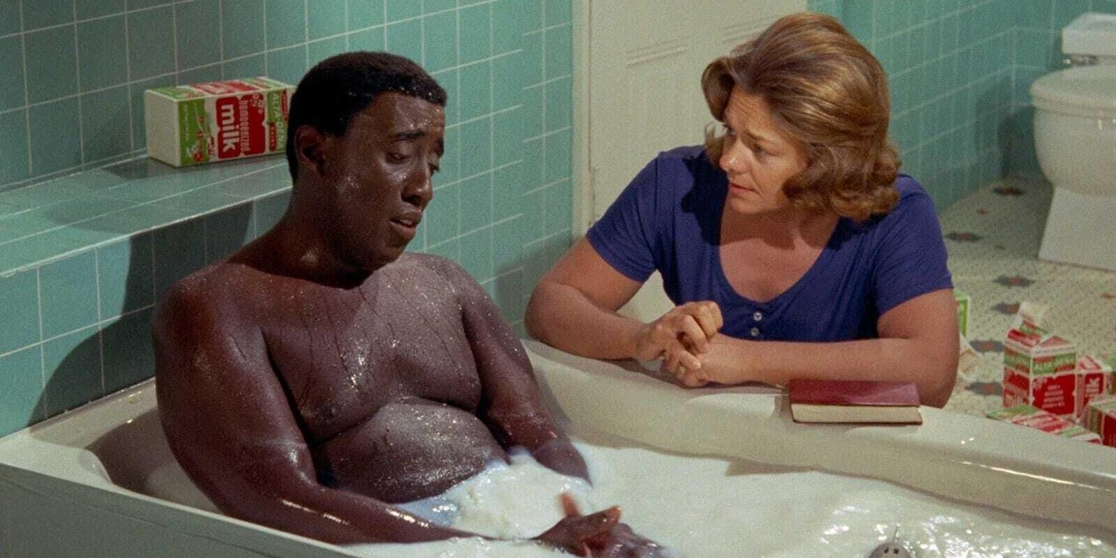 Godfrey Cambridge as Jeff Gerber looking dejected as he talks to Estelle Parsons as Althea Gerber while bathing in milk in &lsquo;Watermelon Man&rsquo; (1970)