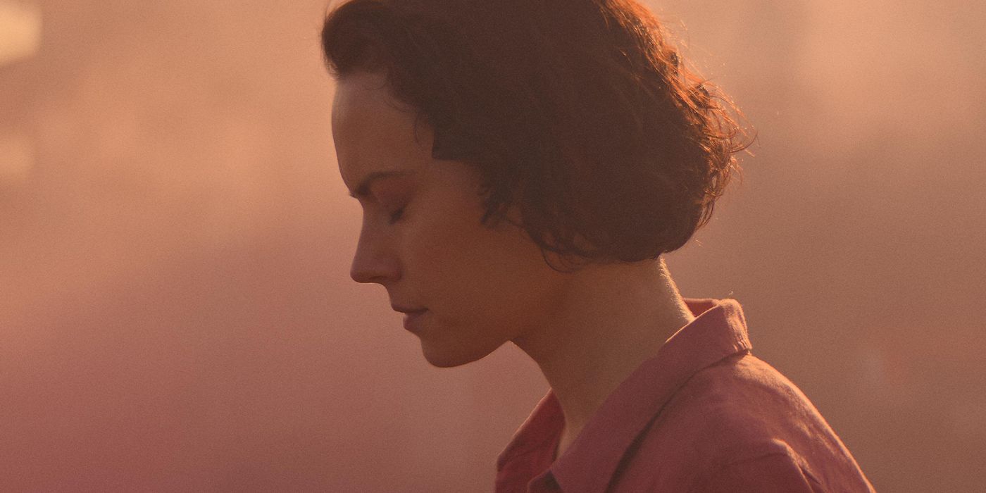 Daisy Ridley with her head down in a still from We Bury the Dead