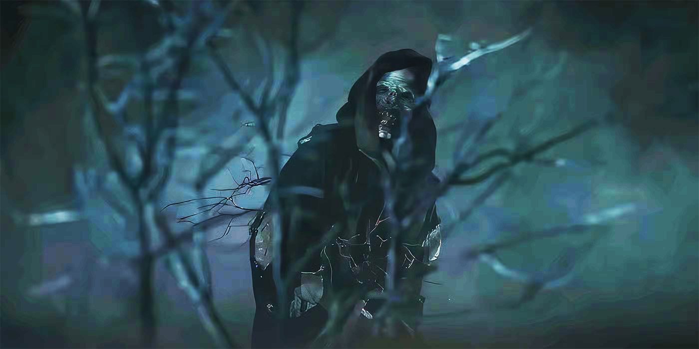 A cloaked dark figure behind a dead tree with a monstrous face called the Ye'iitsoh from Dark Winds Season 3