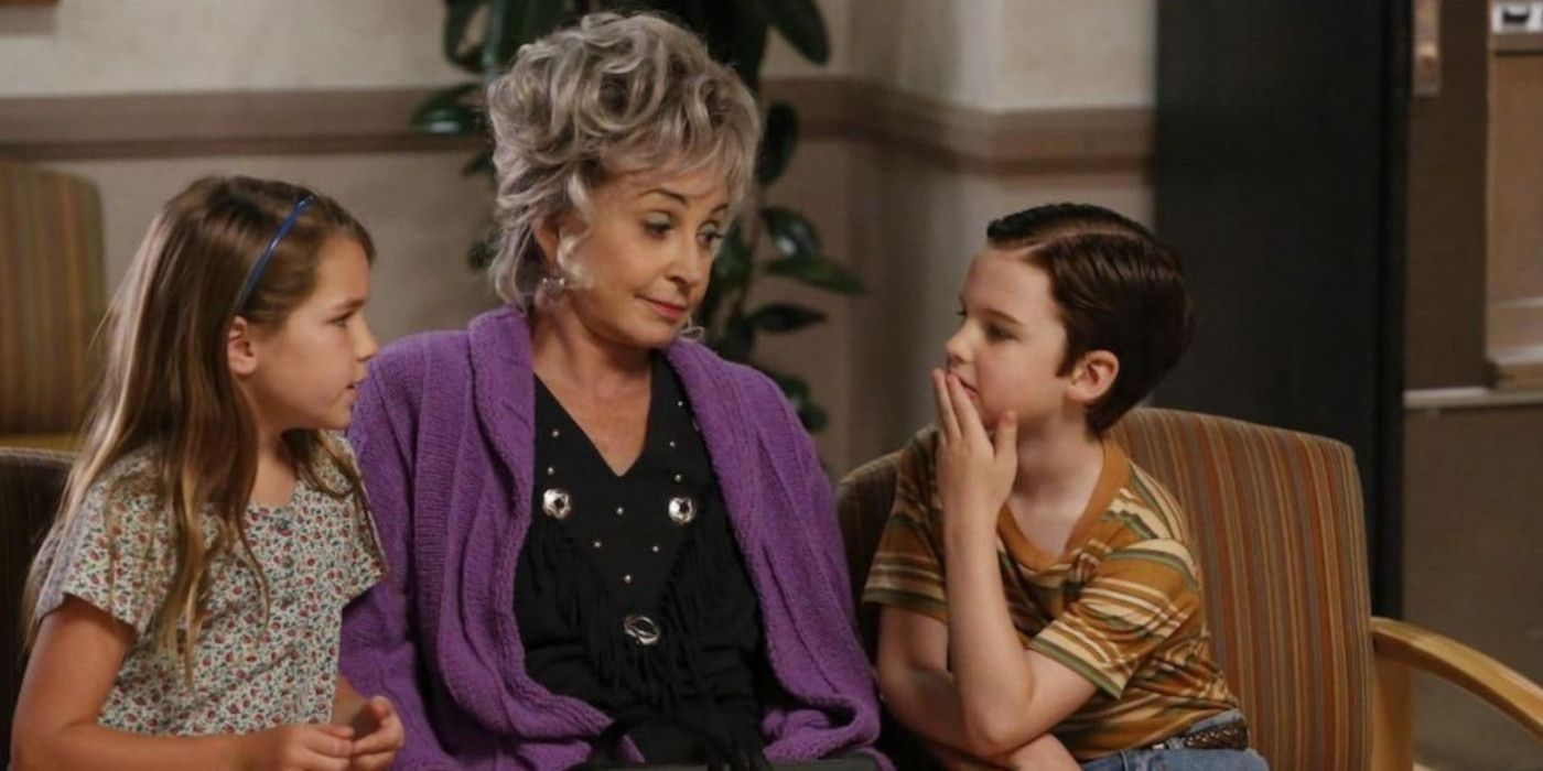 Connie sits with Missy and Sheldon in a waiting room in Young Sheldon