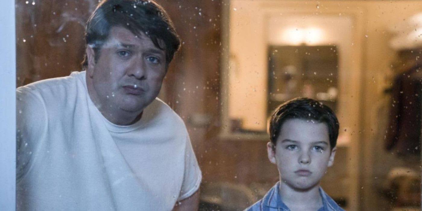 George Sr. and Sheldon look out a rainy window in Young Sheldon