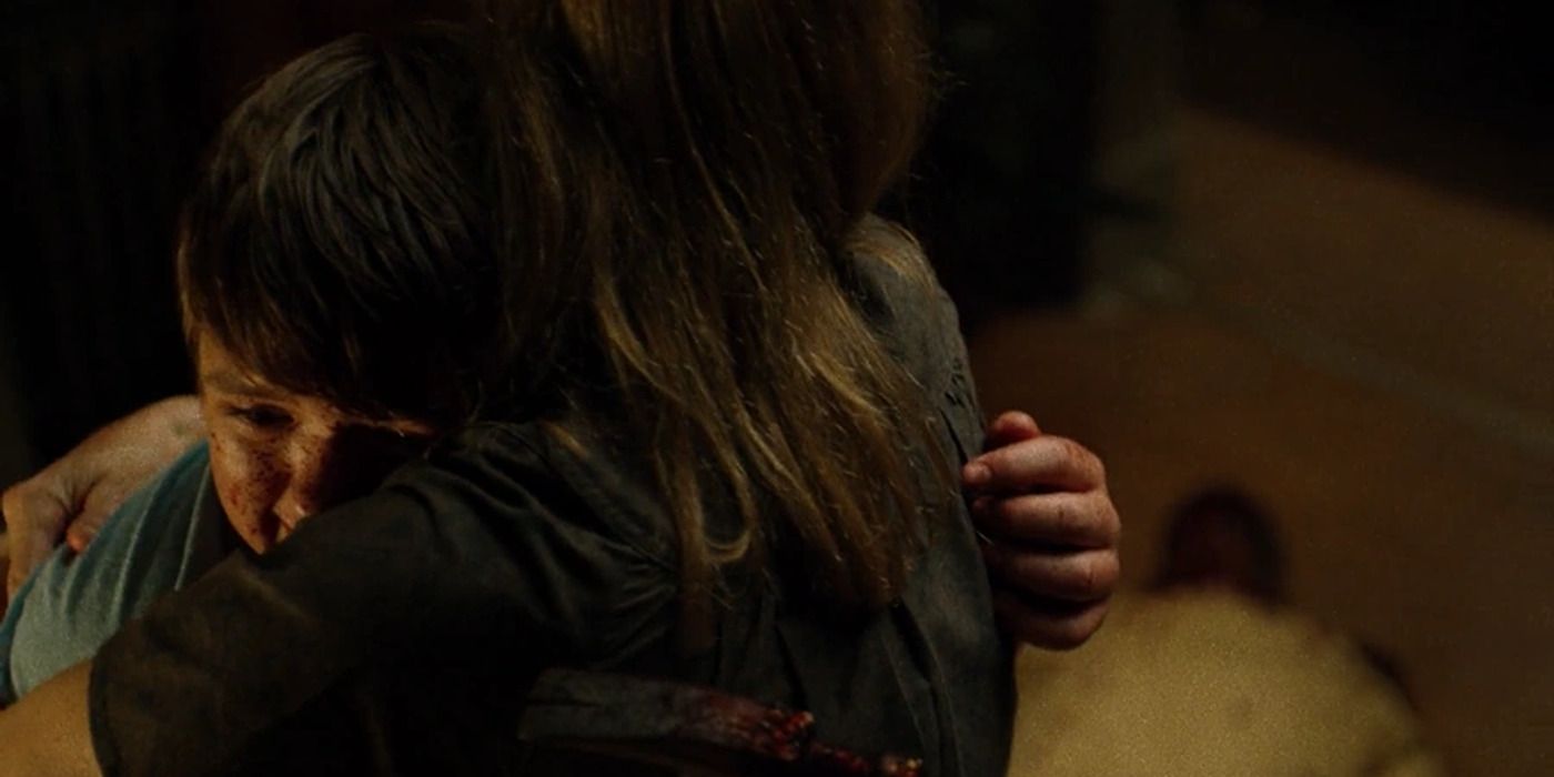 Young Wilson Fisk, face bloody, hugging his mother in Daredevil.