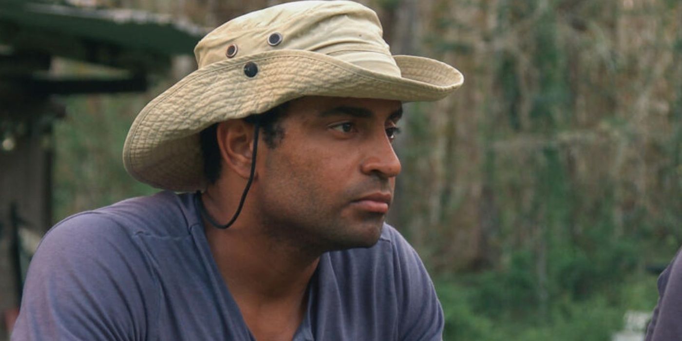 Zak Catchem wears a hat and looks intently off-camera outdoors on Swamp People.