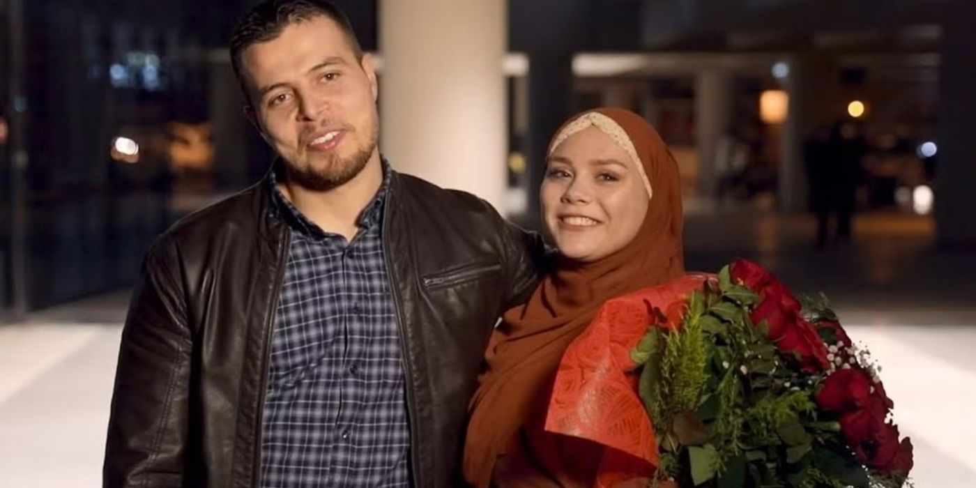 Avery Mills holds flowers standing next to her partner, Omar Albakour on 90 Day Fiancé.