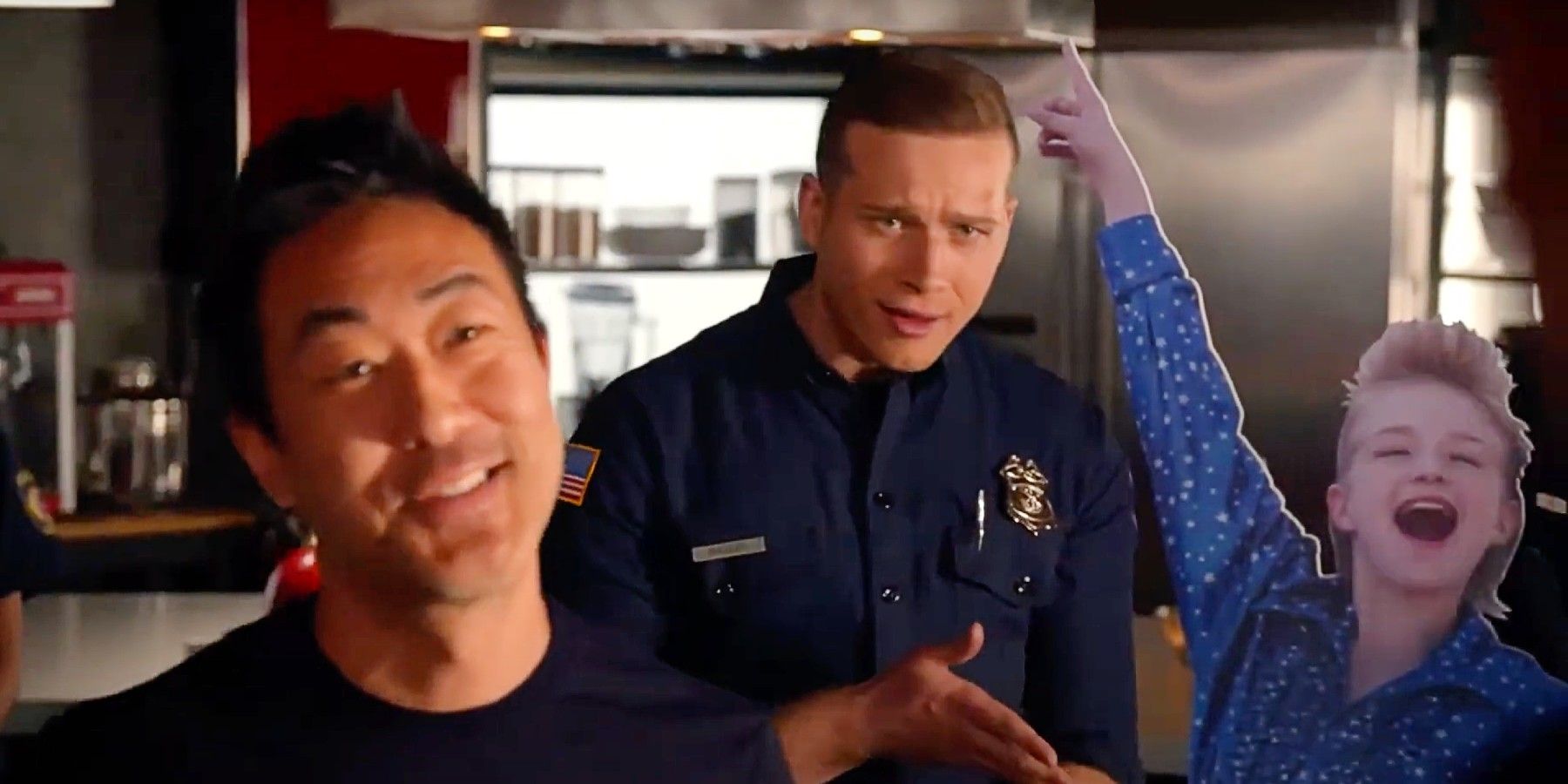 Chimney and Buck standing with a cardboard cutout of Bobby as a child in 9-1-1 Season 3.