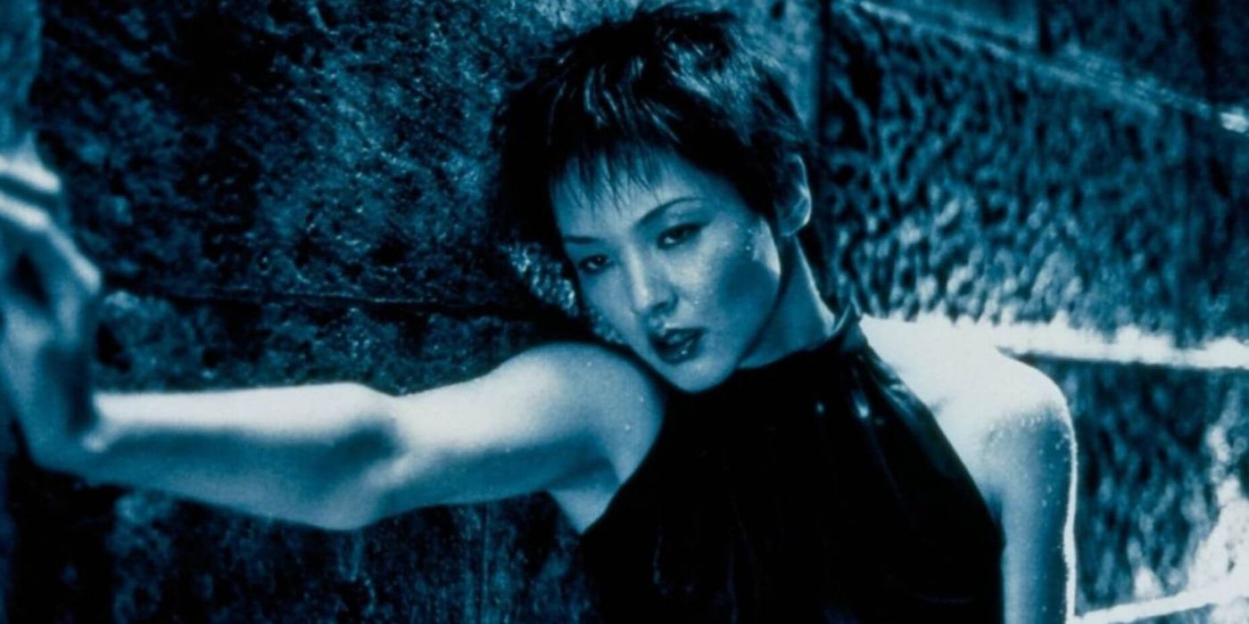 Asuka Kurosawa as Rinko holding on to a wall and looking tired in A Snake of June