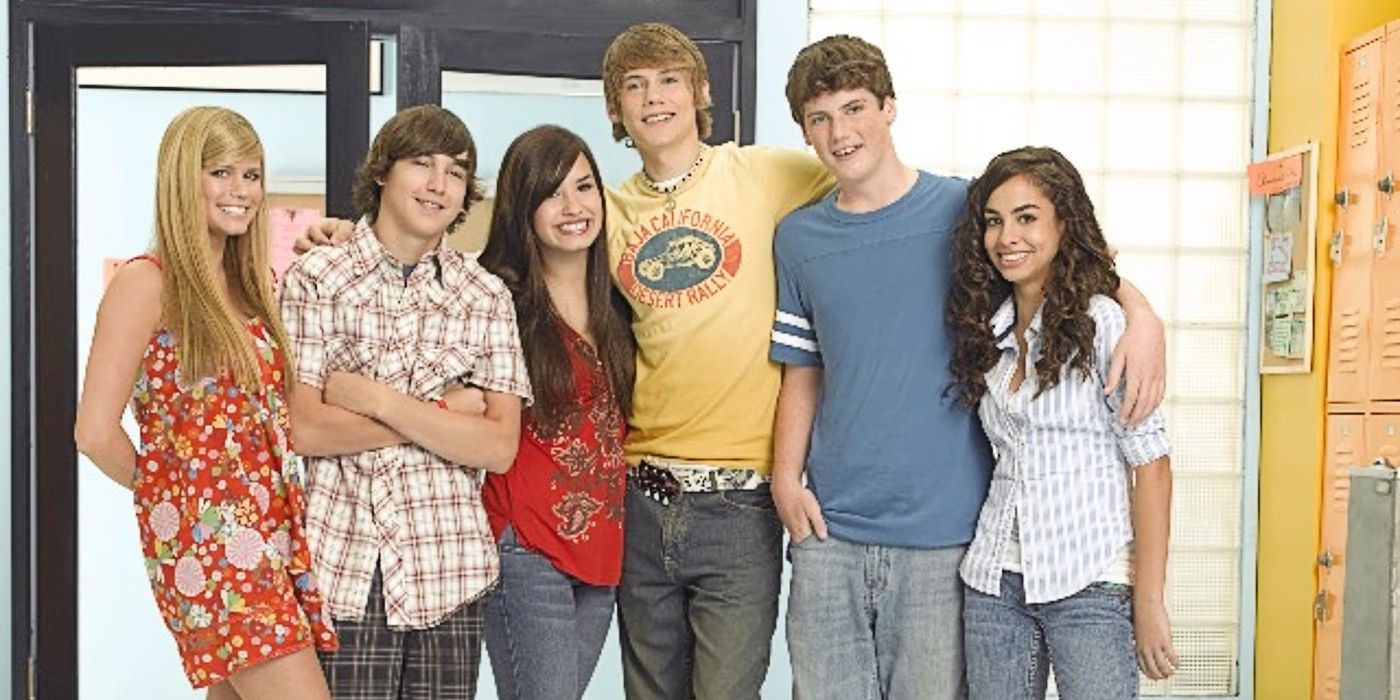 The promo photo for As the Bell Rings with the cast standing inside school doors.