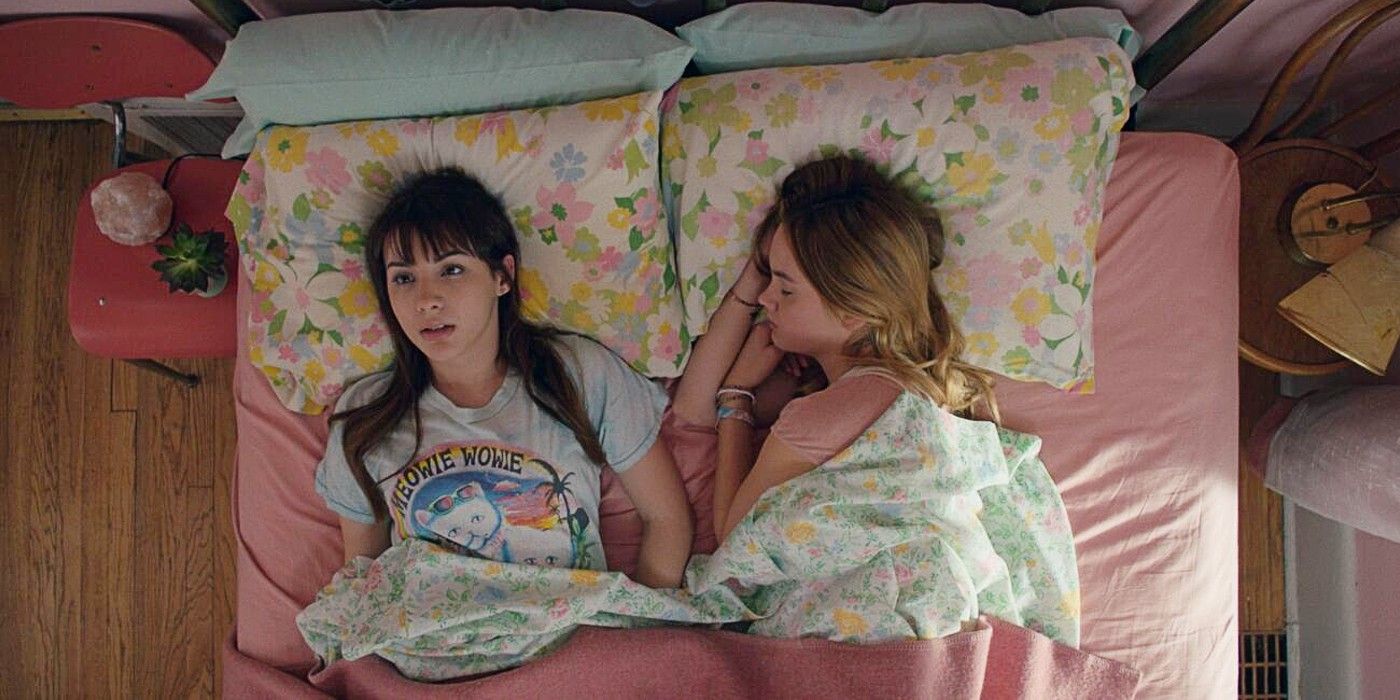 April lying awake next to a sleeping Clara in Banana Split (2018)
