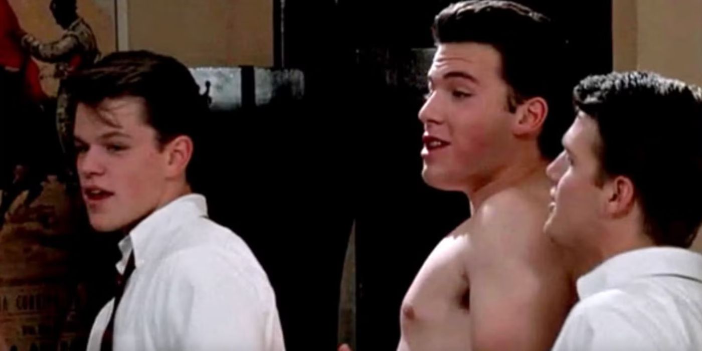 Matt Damon in a shirt and Ben Affleck shirtless in a scene in School Ties.