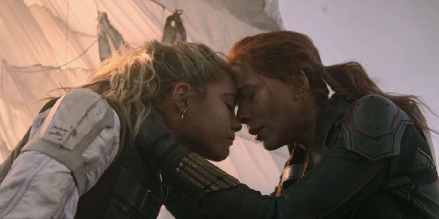 Natasha (Scarlett Johansson) and Yelena (Florence Pugh) touch foreheads with emotion in Black Widow.