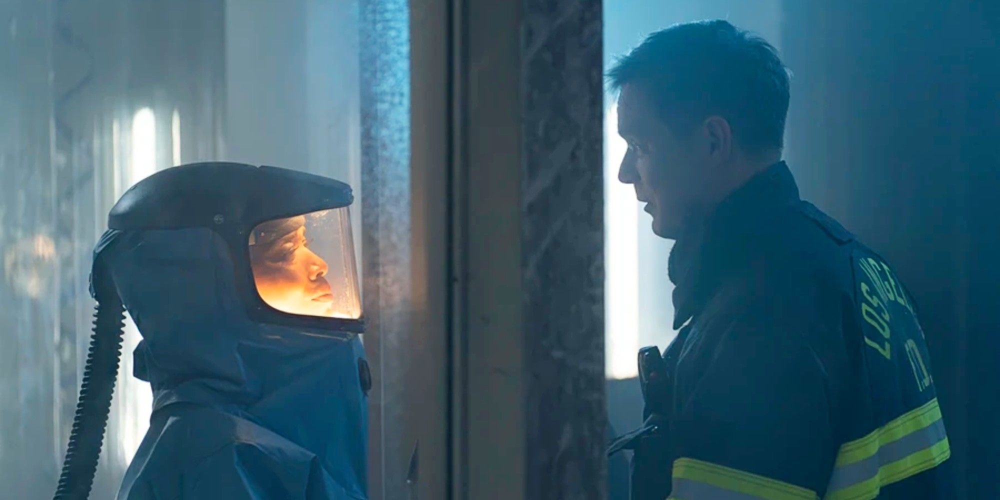Bobby Nash and Athena Grant saying goodbye through a glass door in 9-1-1