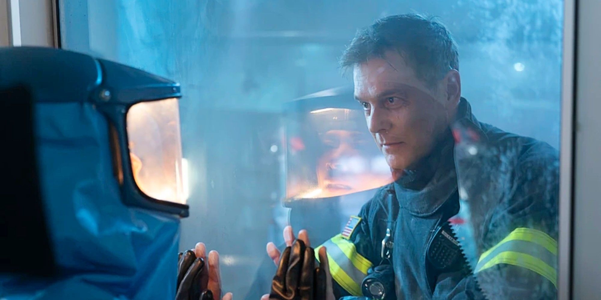 Bobby Nash and Athena Grant saying goodbye through a glass door in 9-1-1