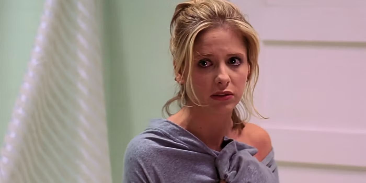 Buffy crying in her bathroom and looking at an offscreen Spike in Buffy the Vampire Slayer.