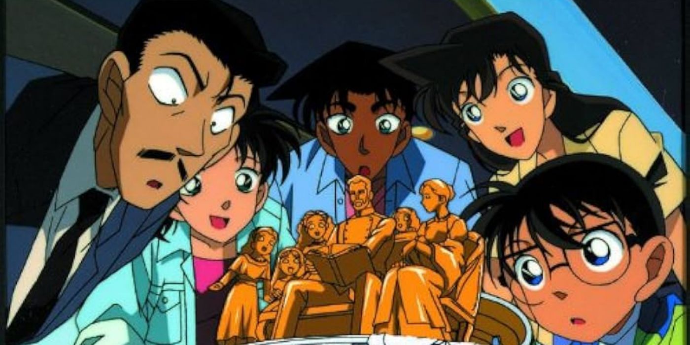 Cast of Detective Conan looking at a statue in Case Closed: The Last Wizard of the Century