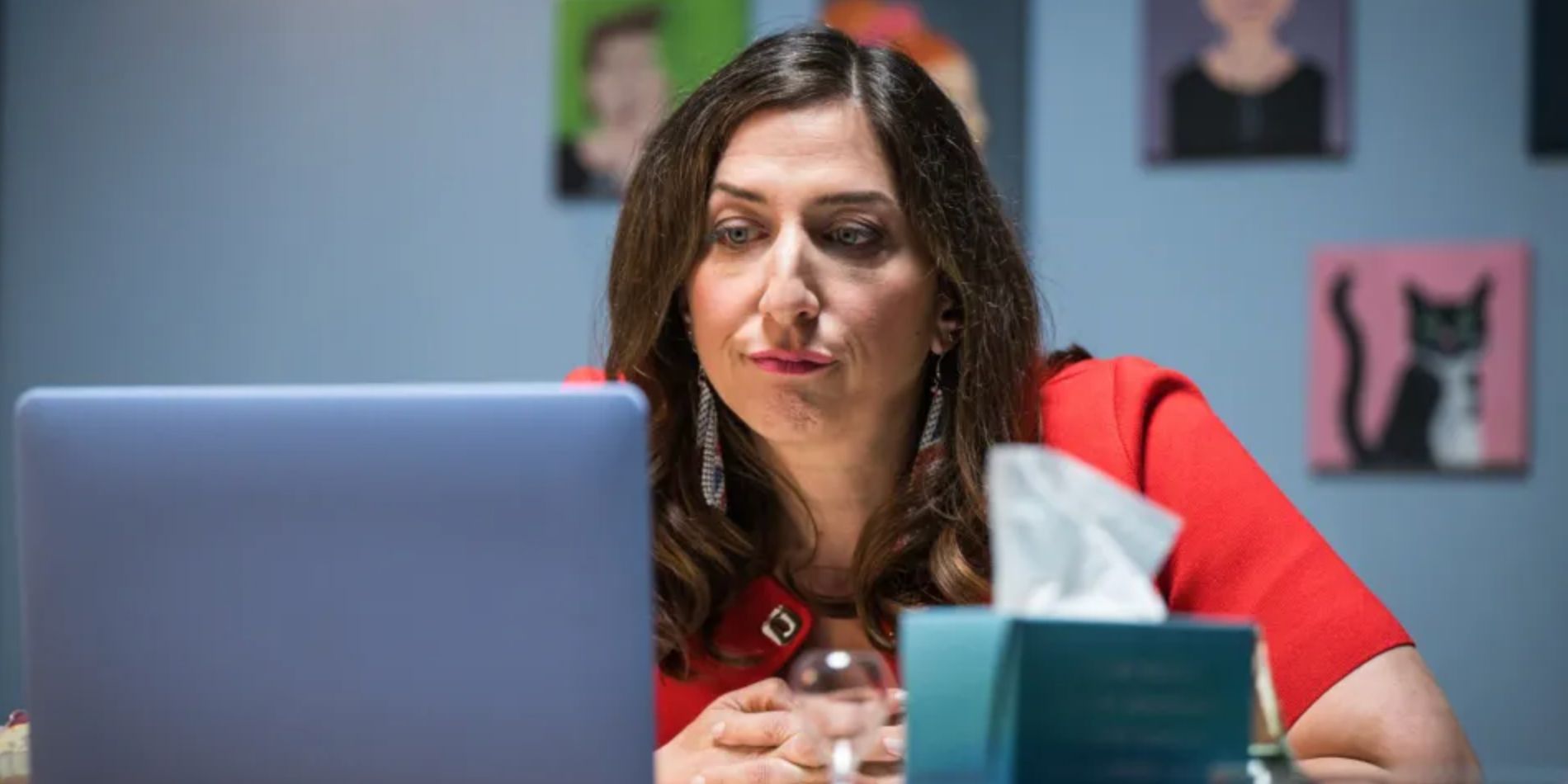 Chelsea Peretti looking at her laptop in Am I Being Unreasonable Season 2