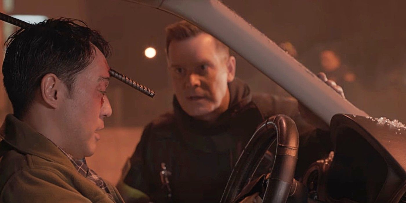 Bobby Nash helping Chimney Han who has a rebar going through his head as he sits in a car in 9-1-1 Season 1.