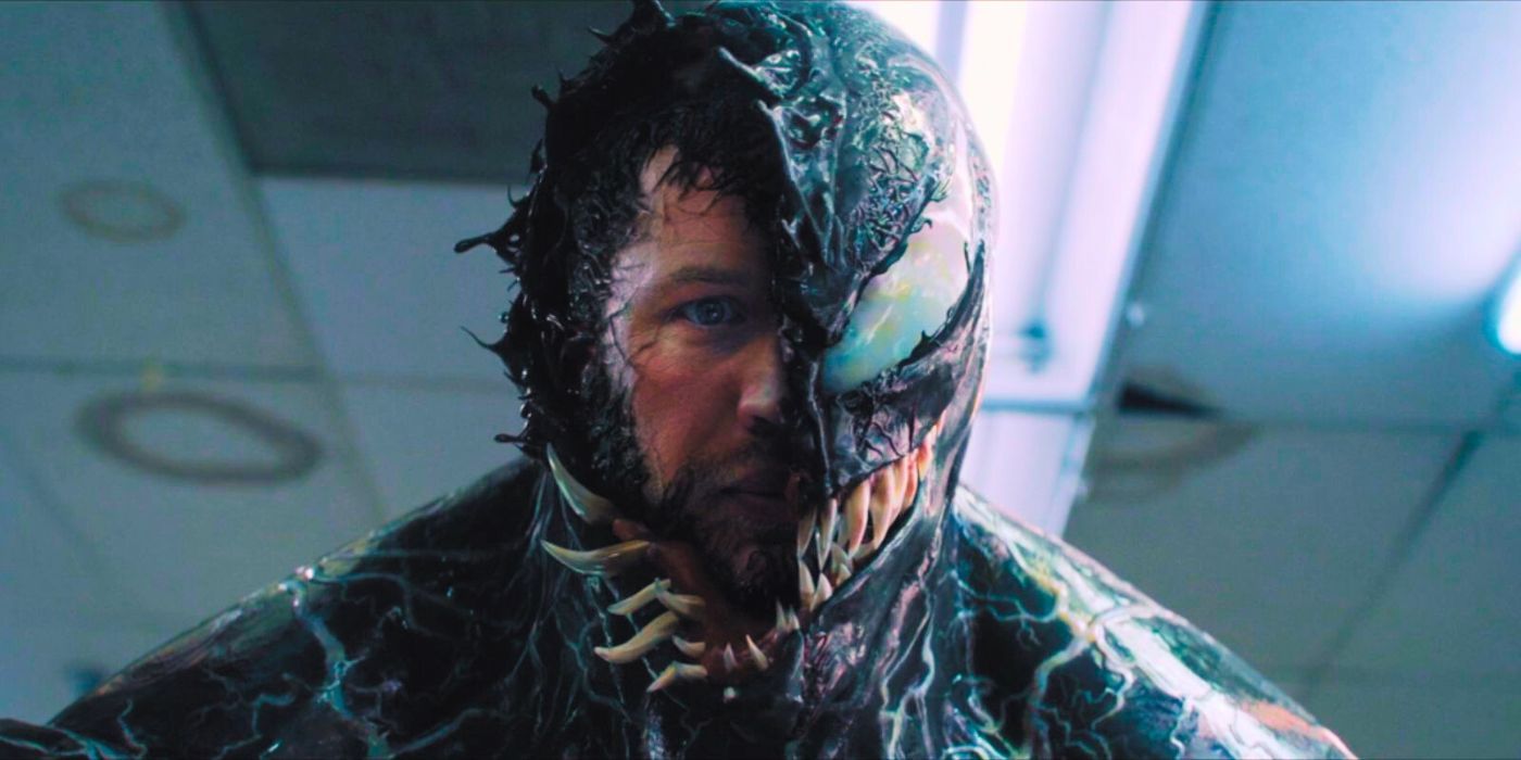 The face of Eddie Brock, played by Tom Hardy, peaks out from beneath Venom in &lsquo;Venom&rsquo;.