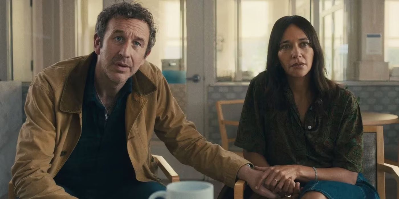 Chris O&rsquo;Dowd as Mike holds hands with Rashida Jones as Amanda, looking stunned in an office in Black Mirror.