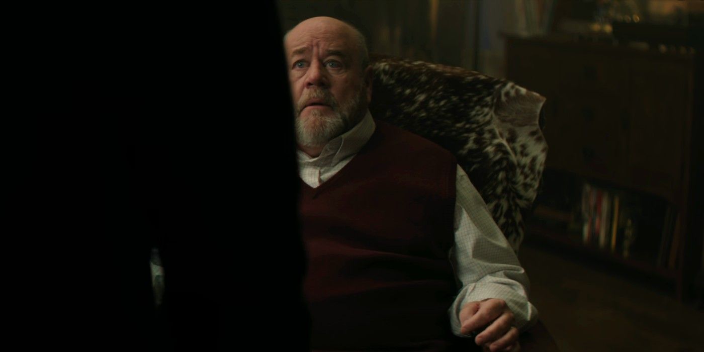 Joe standing over Uncle Bob in You Season 5