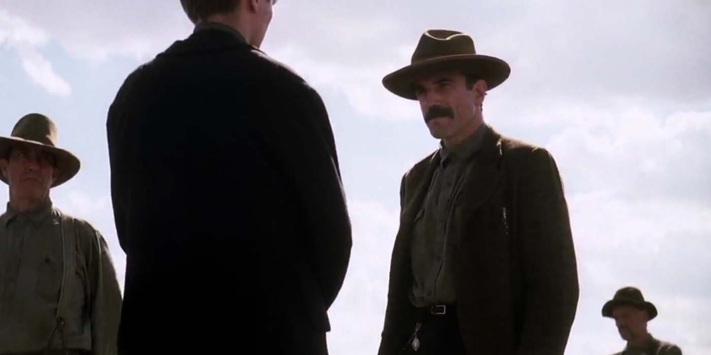Daniel looks at Eli menacingly in There Will Be Blood.