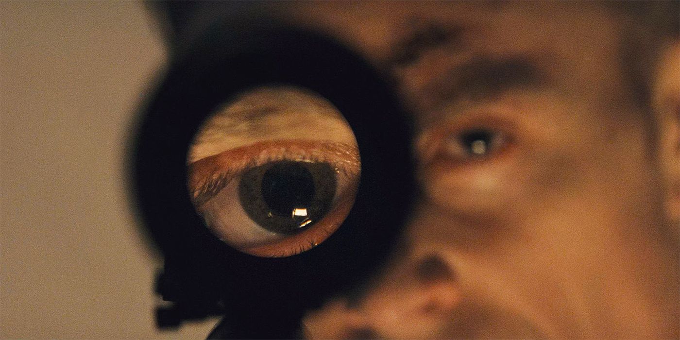 Wilson Bethel as Ben Poindexter/Bullseye looking through a sniper scope in Daredevil: Born Again