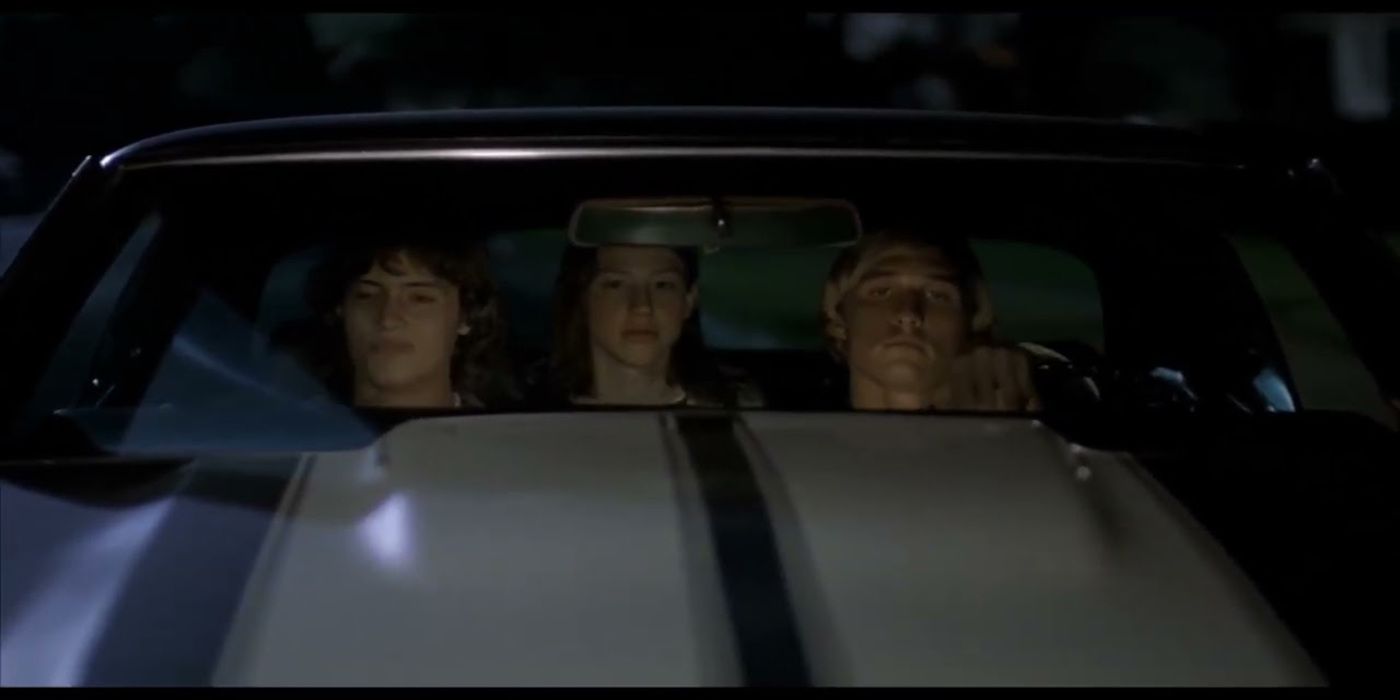 Mitch, Pink, and Wooderson are in a car at night in Dazed and Confused.