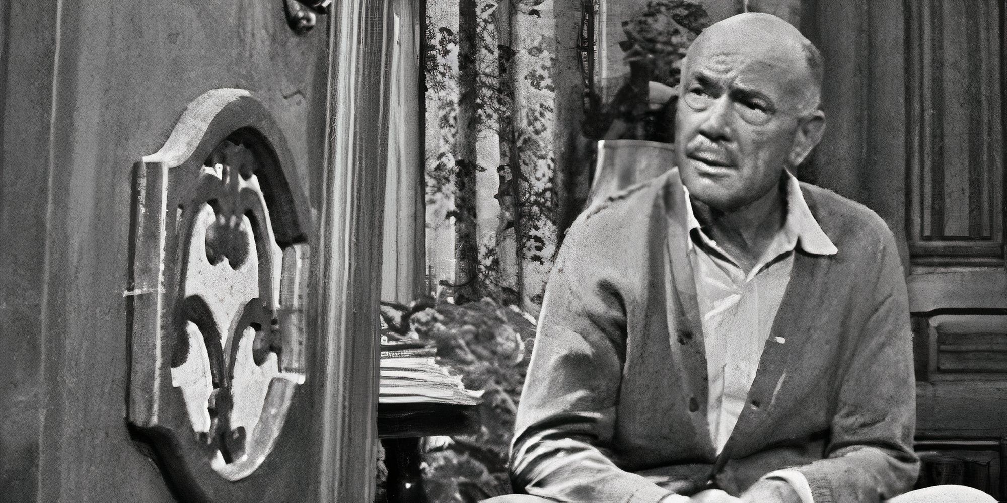 Dean Jagger sentado e olhando para um rádio no Twilight Zone_static