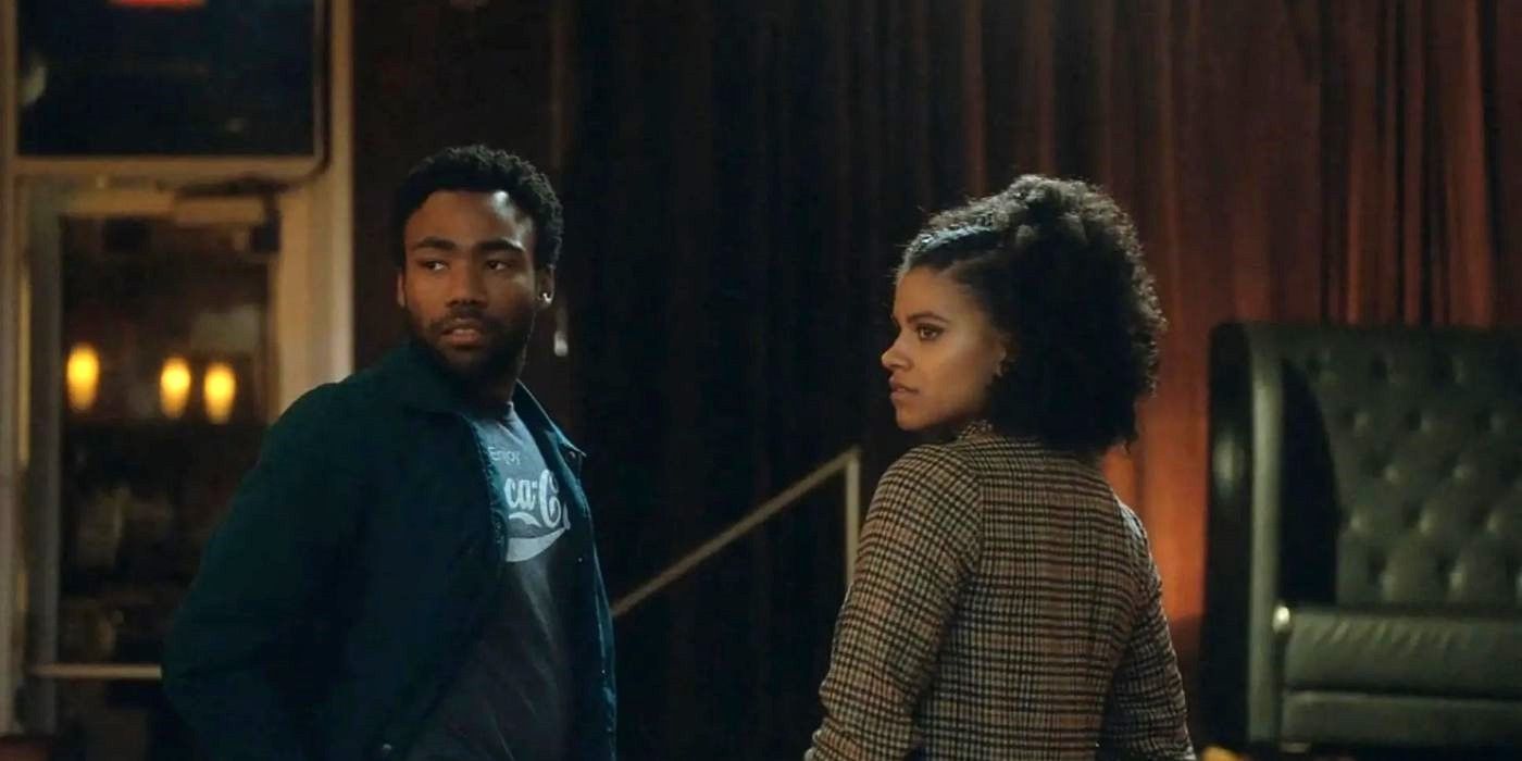 Donald Glover and Zazie Beetz as Earn and Van standing in a room looking behind them in Atlanta.