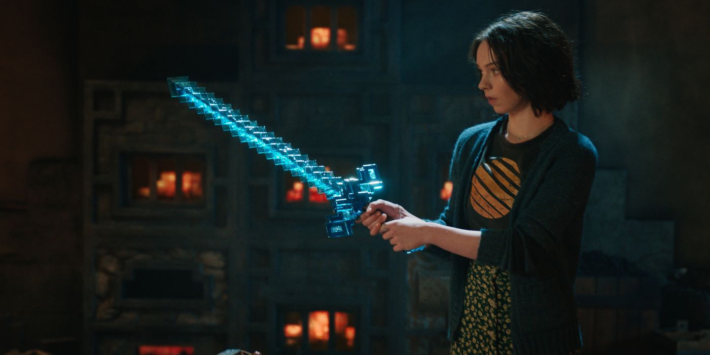 Emma Myers as Natalie holding a dimaond sword in A Minecraft Movie.