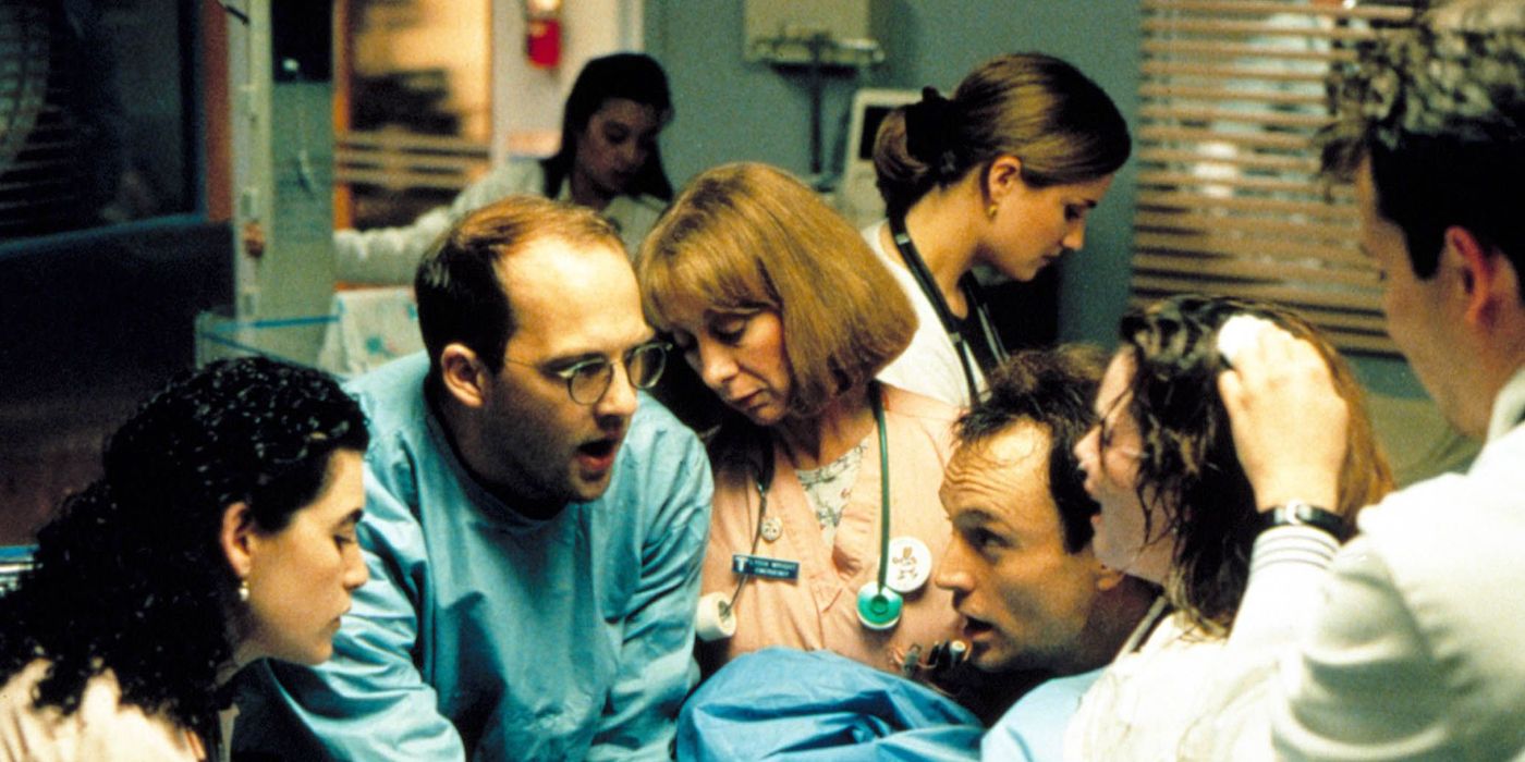 Mark Greene (Anthony Edwards) and Carol Hathaway (Julianna Margulies) delivering a baby in ER.
