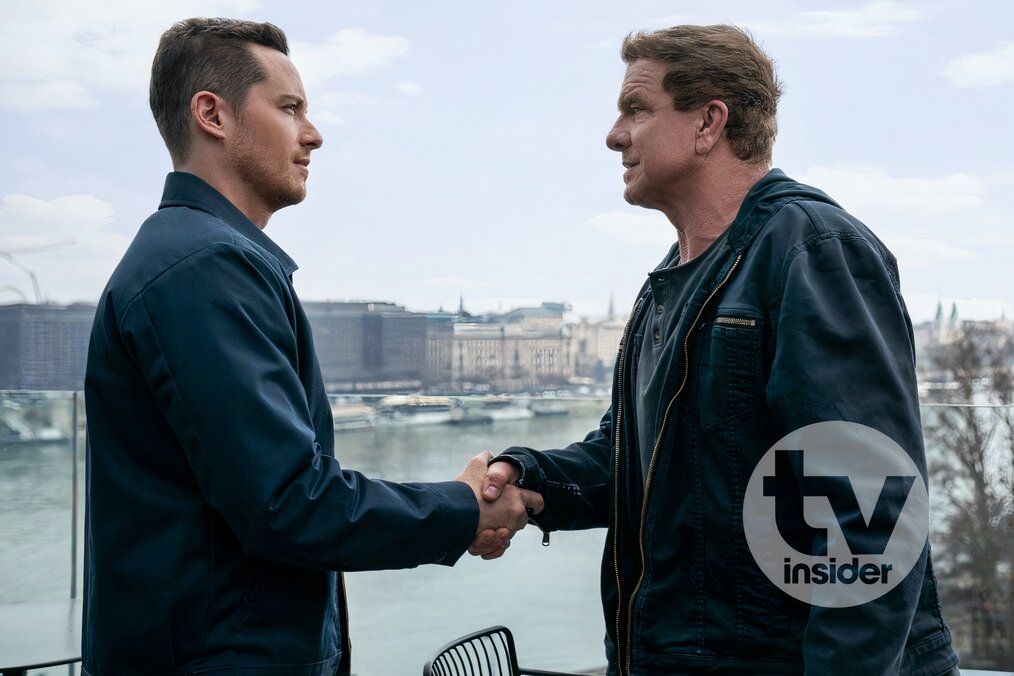 Mitchell reluctantly shakes hands with his biological father Dean in FBI: International