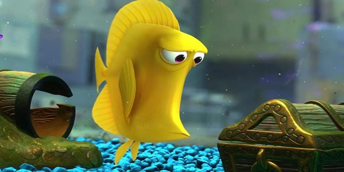 Bubbles, a yellow fish voiced by Stephen Root watches a treasure chest inside a fish tank in Finding Nemo.