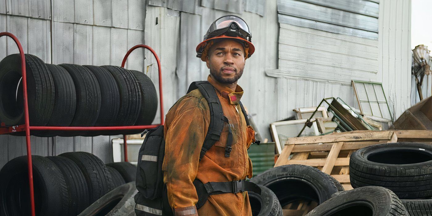 Cole is decked in gear, looking afar at something