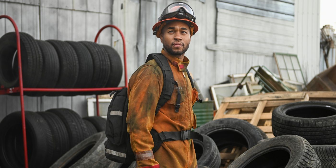 Tye White in his gear in front of a pile of tires in Fire Country Season 3 Episode 19