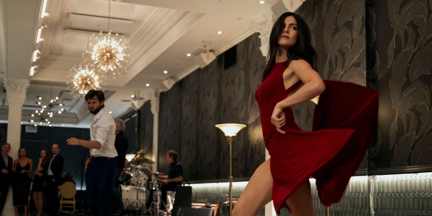 Monica Barbaro flaunting in a red dress in FUBAR Season 2