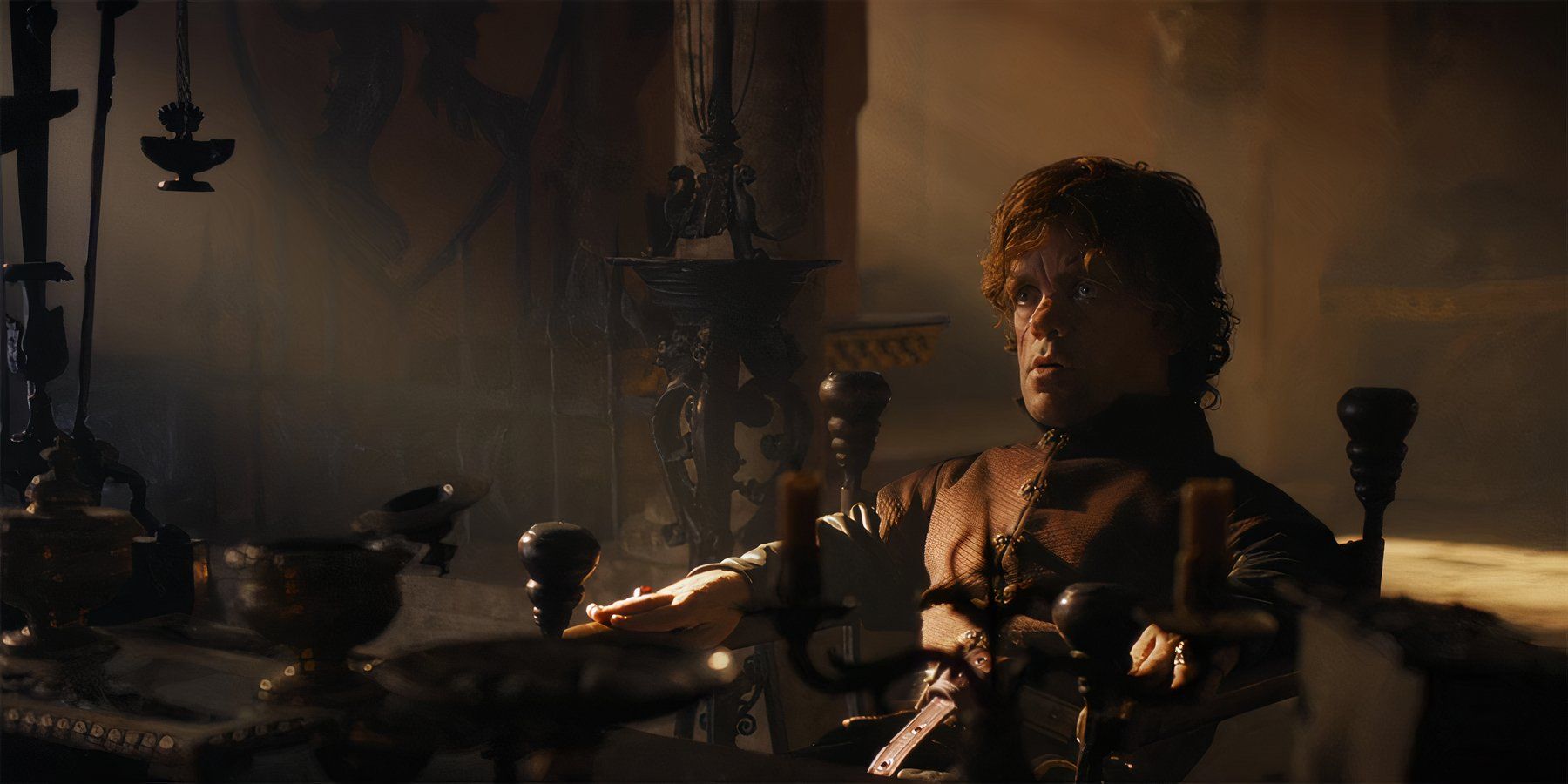Game of Thrones Tyrion Lannister wearing a somber expression while speaking to his father Tywin Lannister  in Season 3 Episode 1.