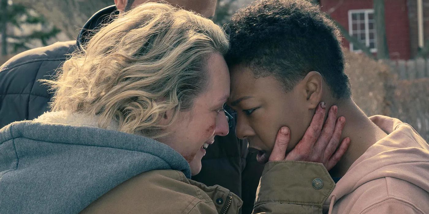 Samira Wiley as Moira and Elisabeth Moss as June hugging and crying together in The Handmaid's Tale.