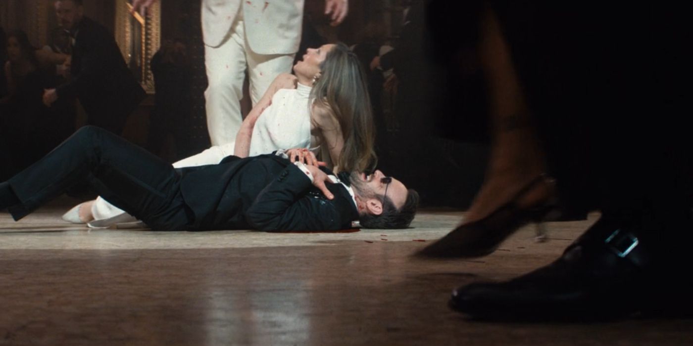 Heather (Margarita Levieva) crouching over Matt (Charlie Cox) in a panic after he takes a bullet for Kingpin (Vincent D&rsquo;Onofrio) in &lsquo;Daredevil: Born Again&rsquo; Episode 8.