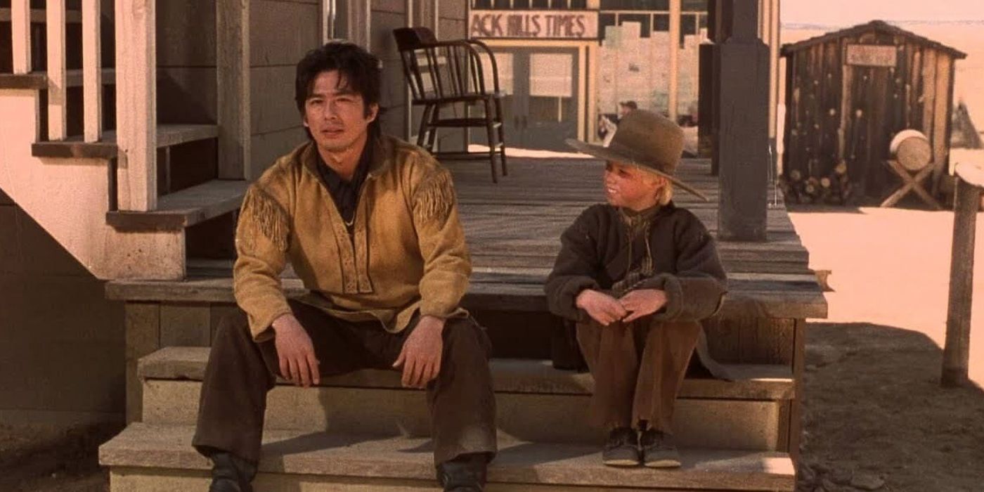 Hiroyuki Sanada and Scott Bachicha sitting on the steps of a house and chatting in East Meets West
