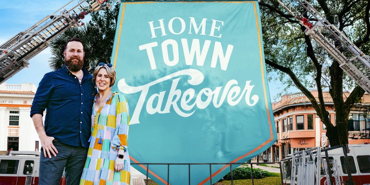 Ben and Erin Napier pose in front of the &lsquo;Home Town Takeover&rsquo; banner in Sebring, Florida.