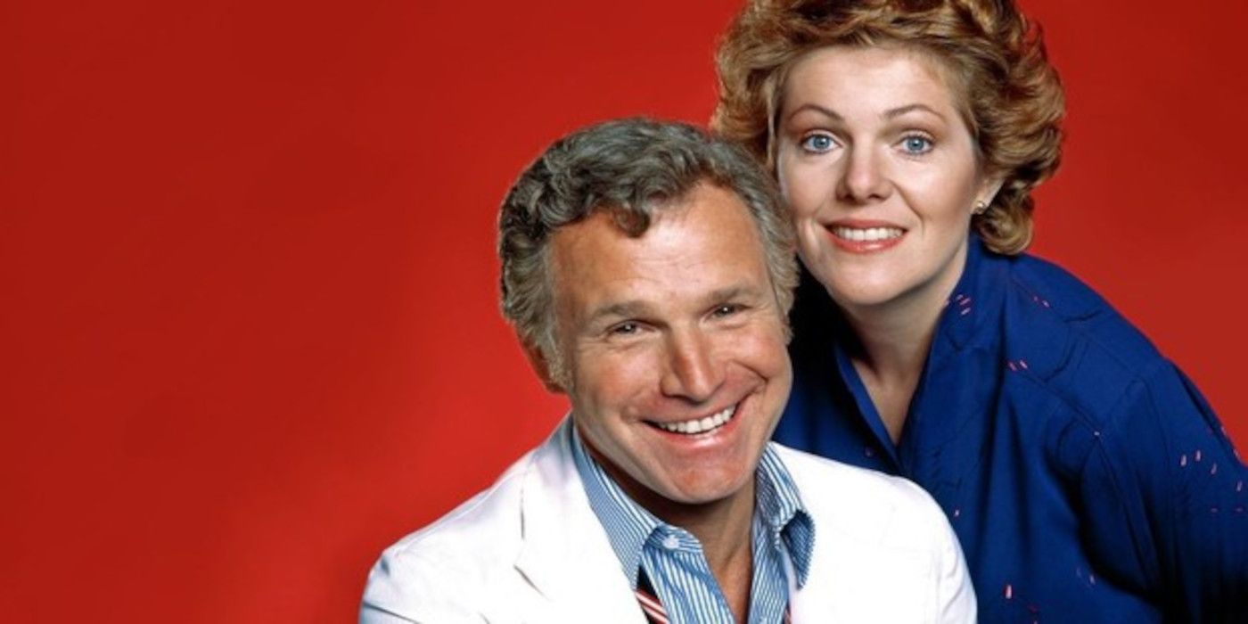 Wayne Rogers and Lynn Redgrave smile in a promotional photo for the sitcom House Calls.